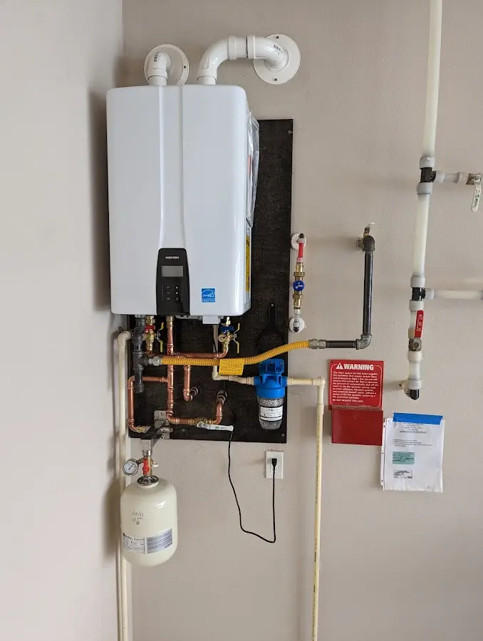 Professional plumber installing copper piping in a Los Alamitos home